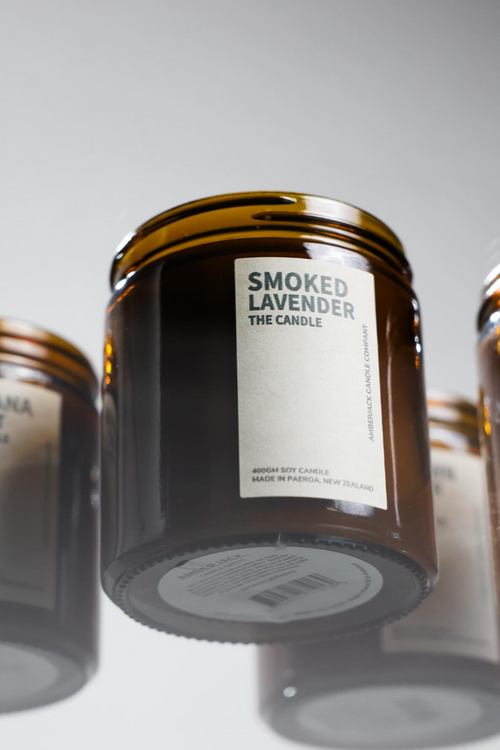 Jar of 'Smoked Lavender' candle with a label on a white background