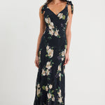 Woman wearing a floral dress on a white background