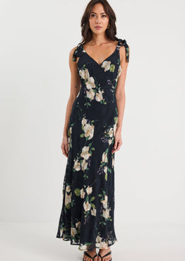 Woman wearing a floral dress on a white background