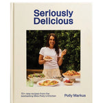 Book cover of 'Seriously Delicious' by Polly Markus with a photo of a woman holding a plate of food.