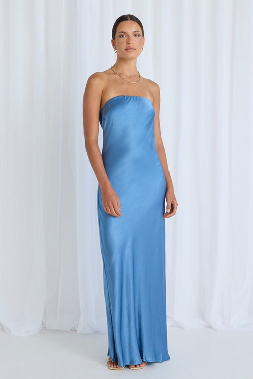 model wears a blue maxi dress