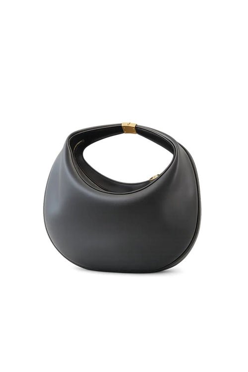 A black leather crescent-shaped shoulder bag with a short handle and gold-tone hardware, shown against a light gray background.