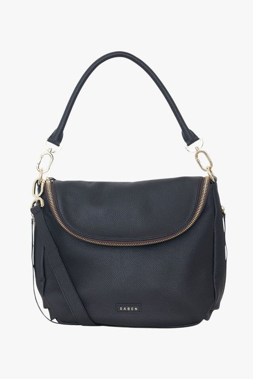 Angled front view of a black pebbled leather shoulder bag featuring a soft fold-over flap with gold zip detailing. The structured shape is complemented by gold hardware and a detachable top handle. The brand name 'SABEN' is embossed in gold at the base front of the bag.