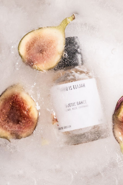 Bottle of 'Wine is Elijah' with figs on a textured surface