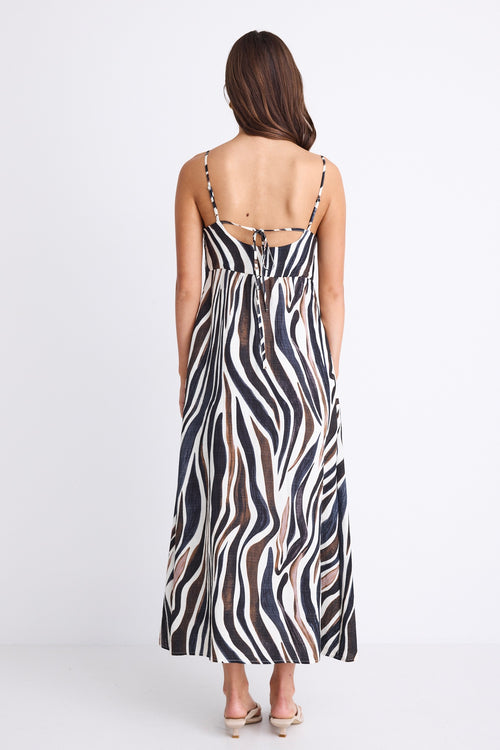 A strappy dress with a tie-back detail and bold chocolate and cream zebra print. Fully lined for comfort, made from a soft viscose-nylon blend.