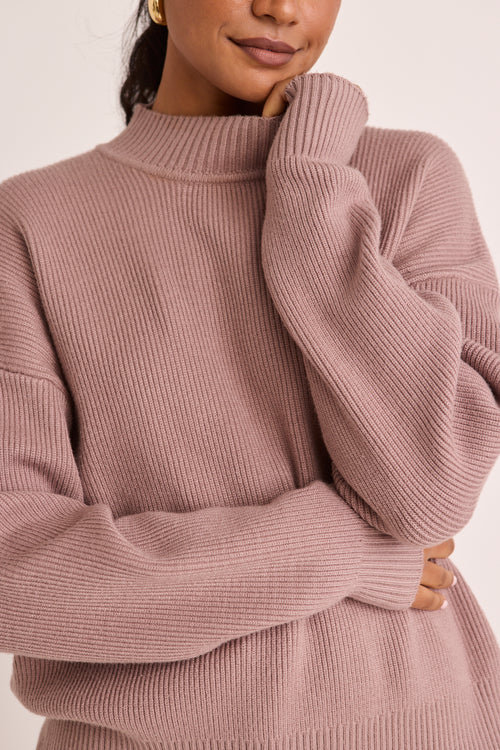 model wears a pink knit