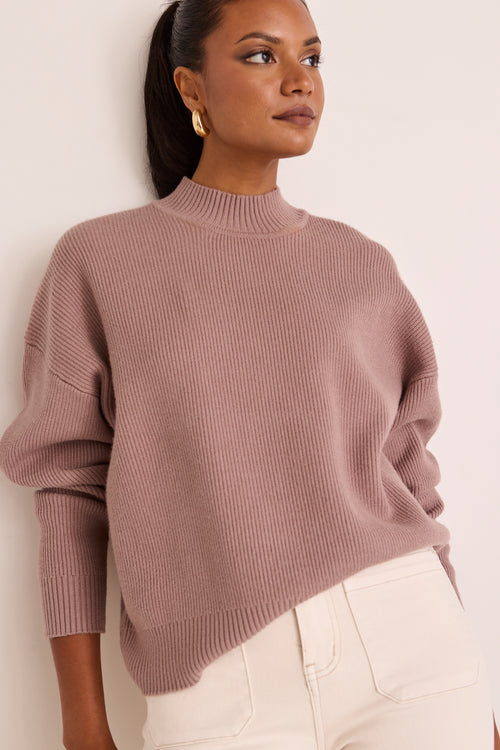 model wears a pink knit