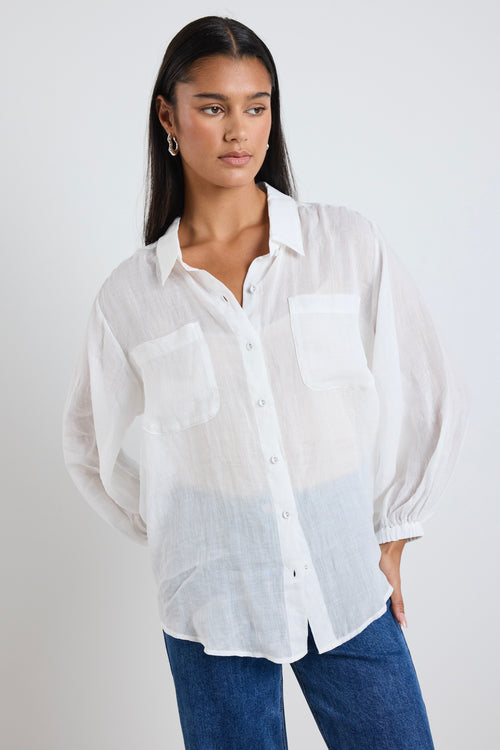 model wears white ivory shirt