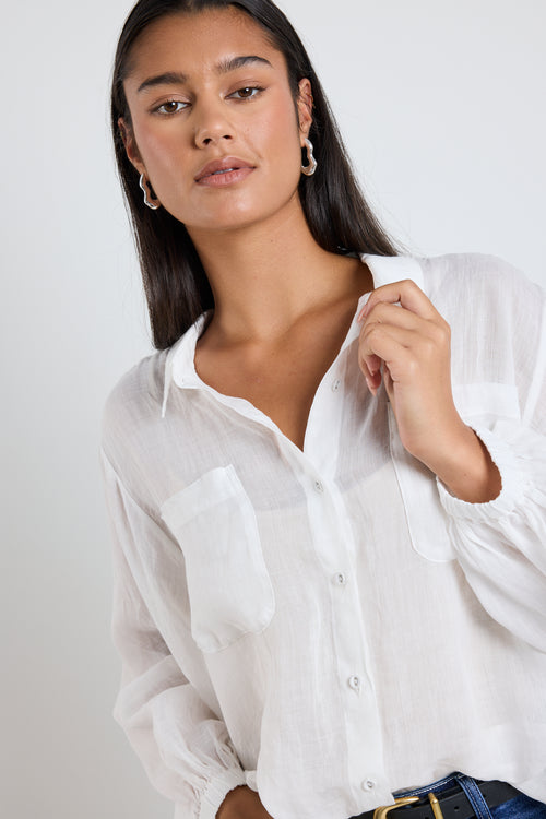 model wears white ivory shirt