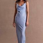 model wears a blue maxi dress