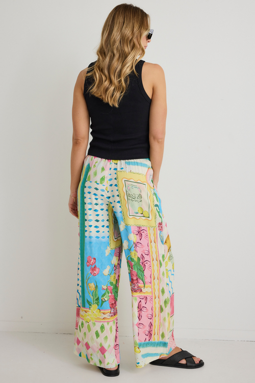 model wears Pink Yellow Holiday Print Pant