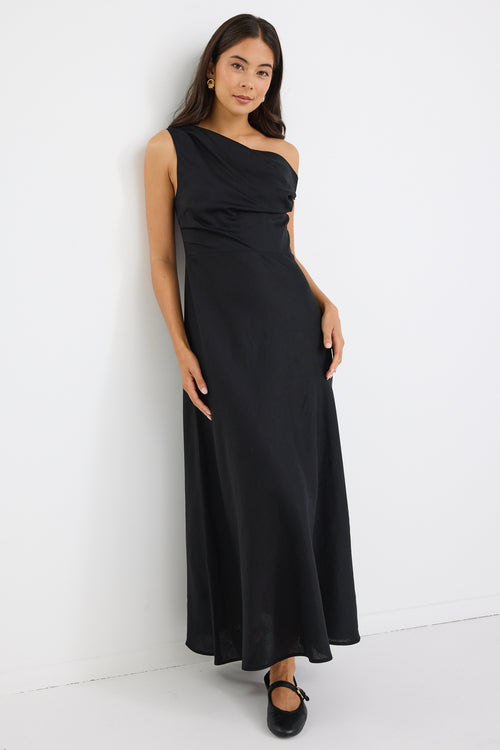 model wears an off the shoulder black linen maxi dress