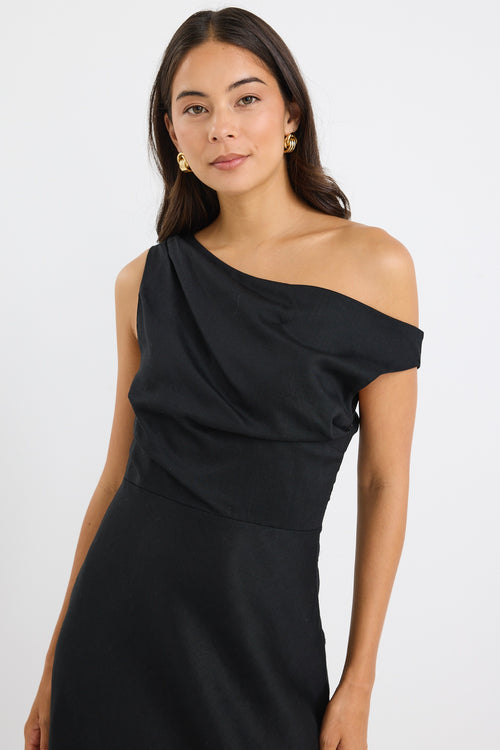 model wears an off the shoulder black linen maxi dress