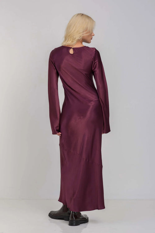 Model wears a plum Burgundy maxi long sleeve dress 