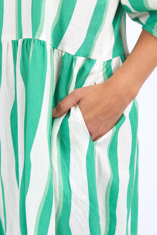 model wears green stripe midi dress