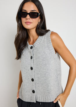 model wears grey knit vest top