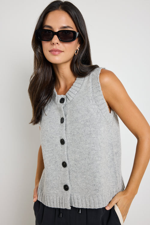 model wears grey knit vest top