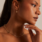 Model wears star pendant earring 