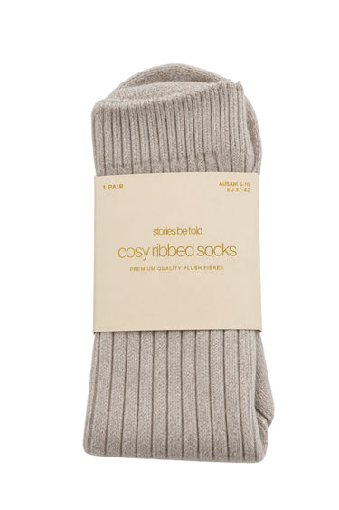 Stone cosy ribbed socks in Stories Be Told packaging with soft plush fibres and ribbed texture.