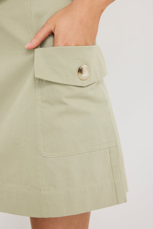 Woman wearing mid-rise chocolate zebra print shorts with an elastic waistband, styled casually with a black top and black sandals.