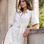 model wears a ecru mini denim dress 