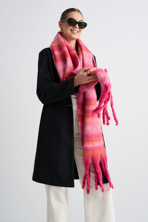 Model wears a pink scarf