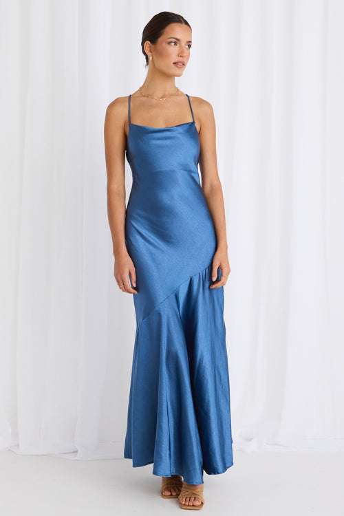 model wears a blue satin maxi dress