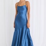 model wears a blue satin maxi dress