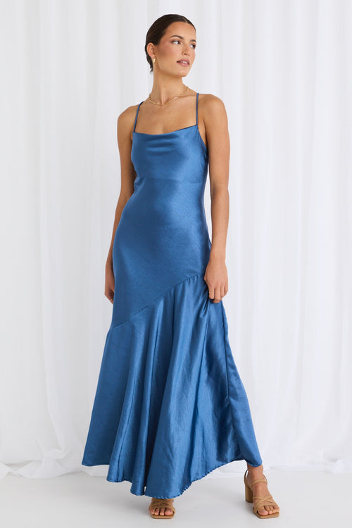 model wears a blue satin maxi dress