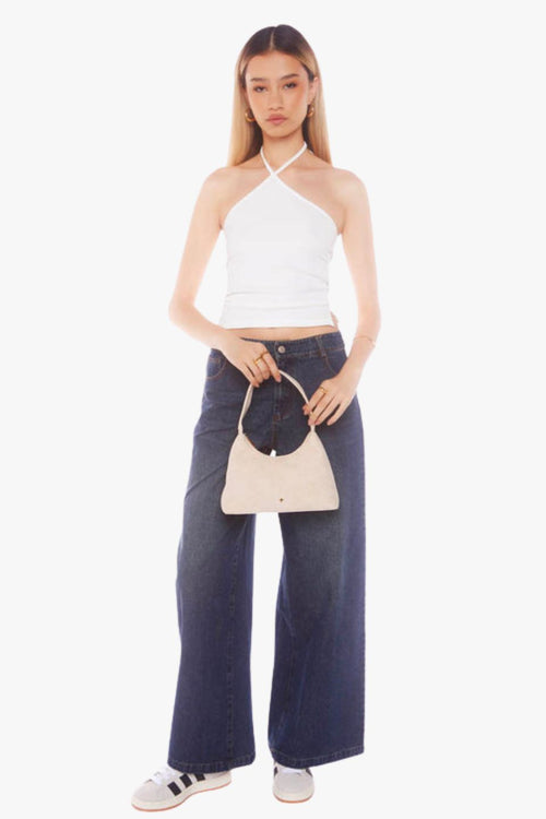 Beige faux suede shoulder bag with a minimalist design and single strap handle.