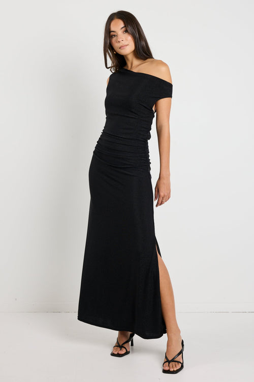 Swift Black Shimmer Jersey Reversible Sleeveless Maxi Dress styled off the shoulder and with a cowl neck, showcasing its versatile design and elegant shimmer finish.