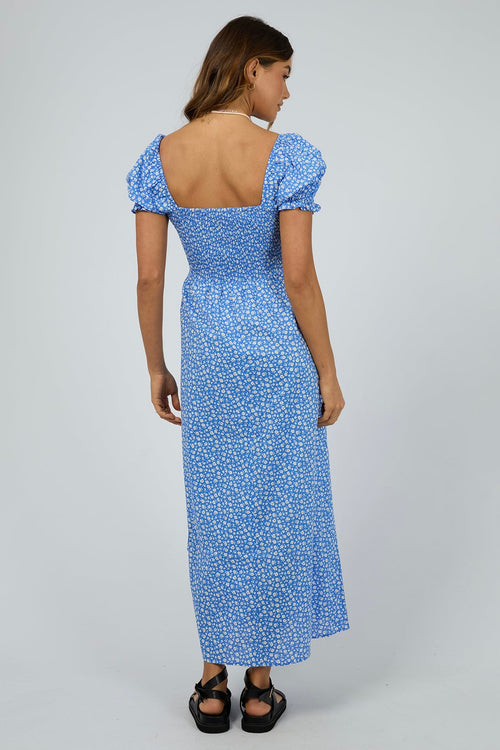 model wears a blue spot maxi dress