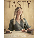 Book cover of 'Tasty' by Chelsea Winter featuring a woman at a table with cakes.
