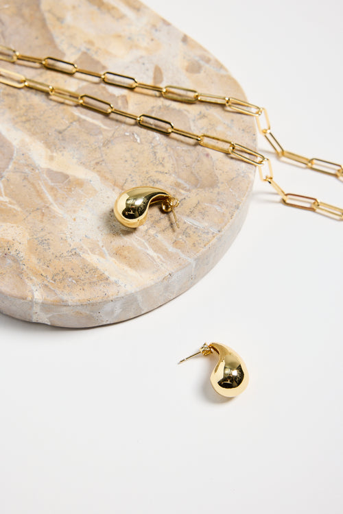 gold-plated brass stud earrings with a smooth, teardrop shape