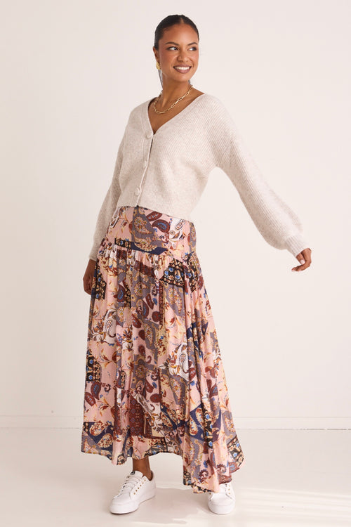 model wears a pink floral maxi skirt