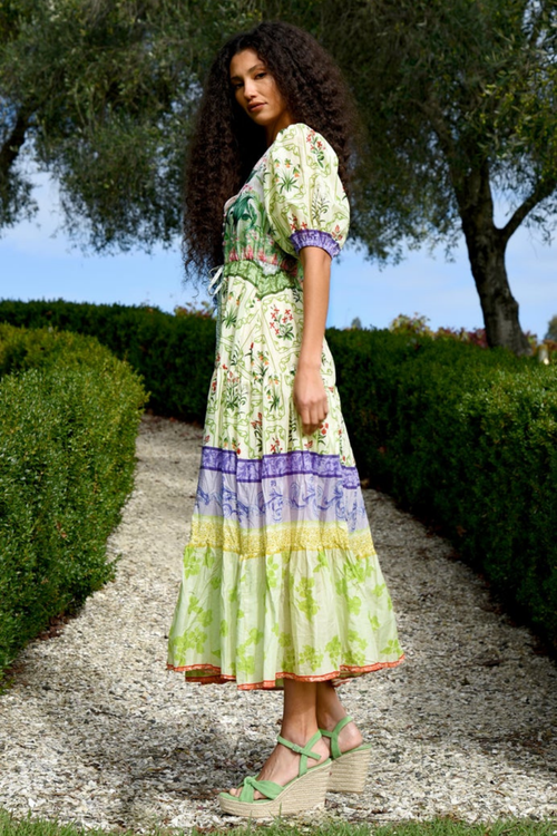 model wears green floral midi dress