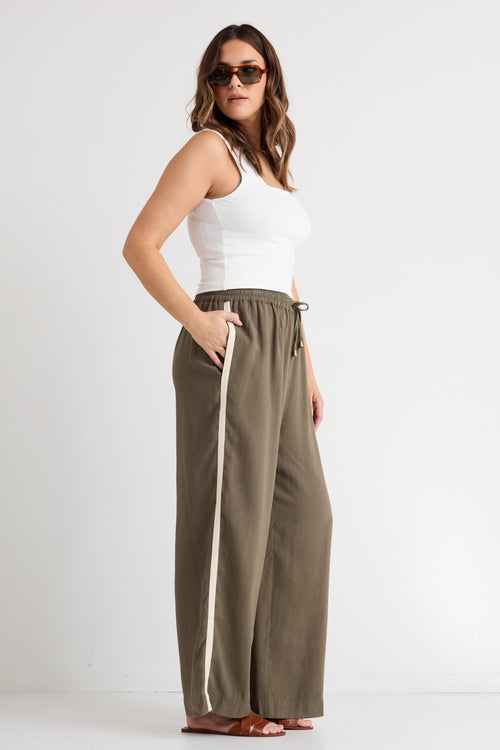 model wears a green wide leg pant