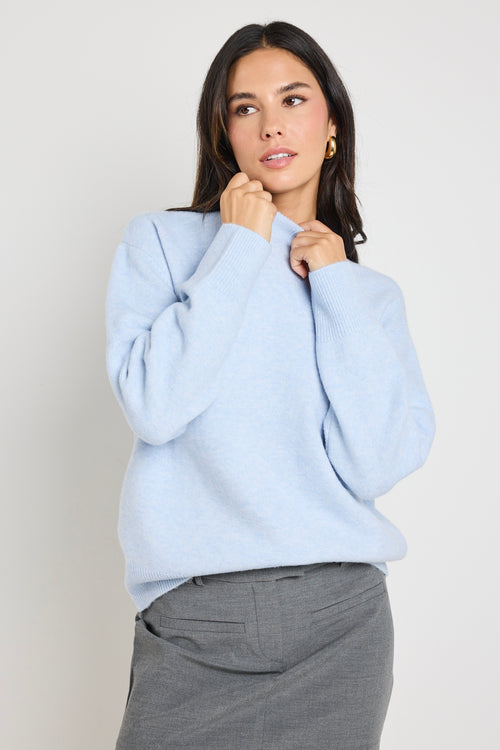 model wears light blue knit jumper