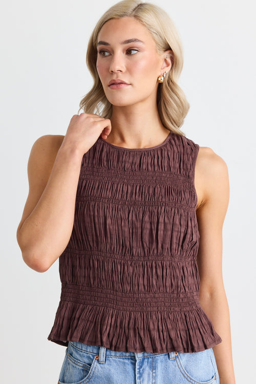 model wears a brown shirred tank top