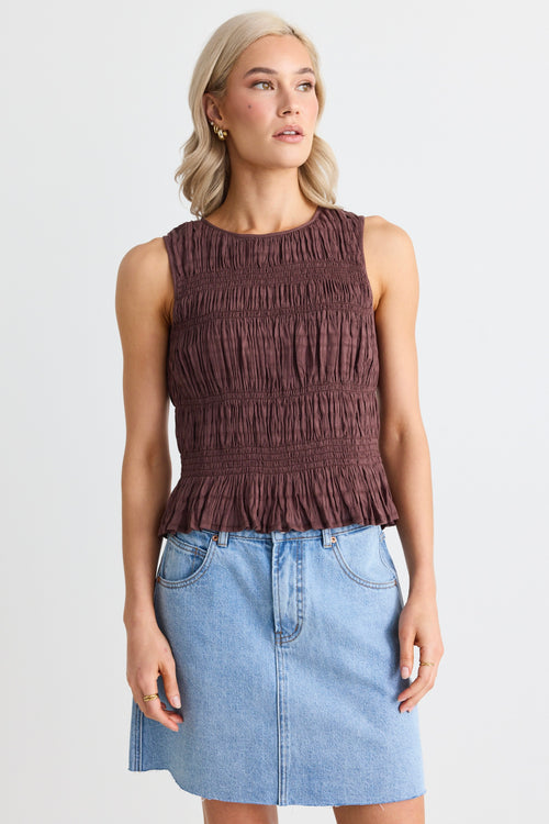 model wears a brown shirred tank top