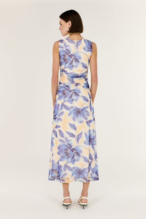 Woman wearing a floral dress on a white background