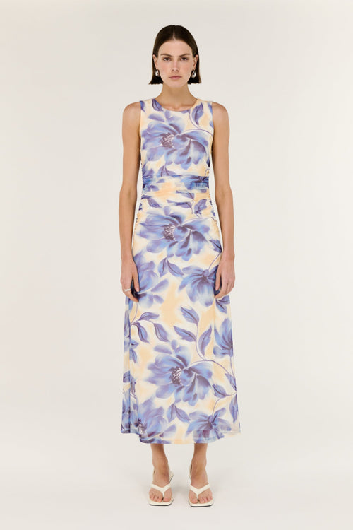 Woman wearing a floral dress on a white background