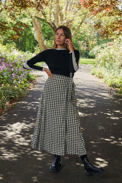 model wears a black long sleeve top