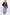 Person wearing a brown fleece pullover and blue jeans on a white background