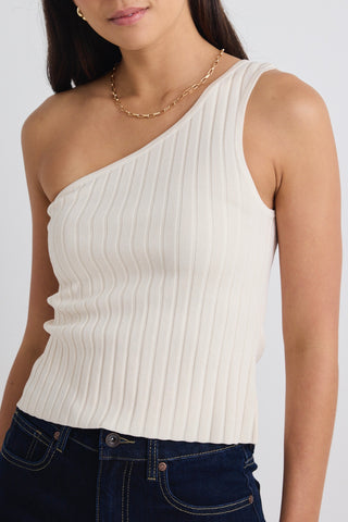 model wears a beige one shoulder top