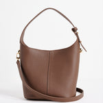 Valencia Brown Leather Multi Strap Mini Tote Bag in a structured bucket silhouette featuring pebbled brown leather, an adjustable shoulder strap and gold hardware, photographed against a clean white background