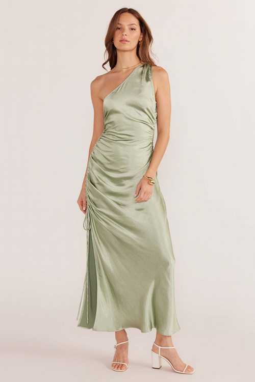 model wears green satin midi dress