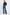 model wears a navy blue blouse with dark blue jeans