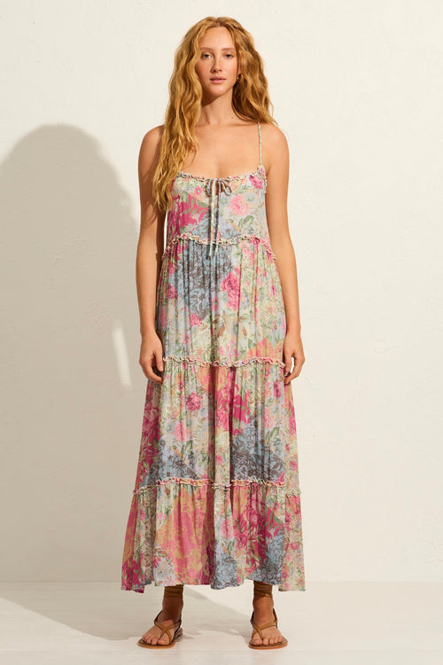 model wears a pink floral maxi dress