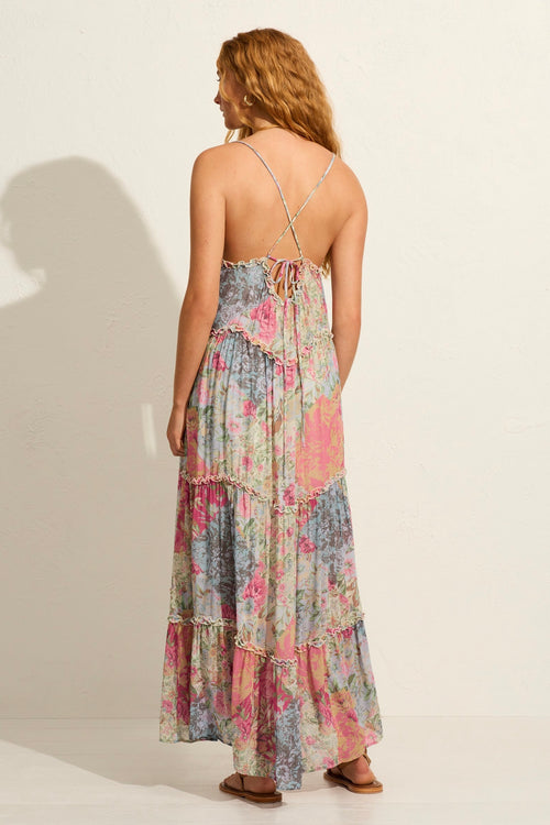 model wears a pink floral maxi dress